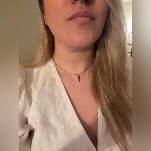 Red cornicello/horn necklace on textured gold tone chain